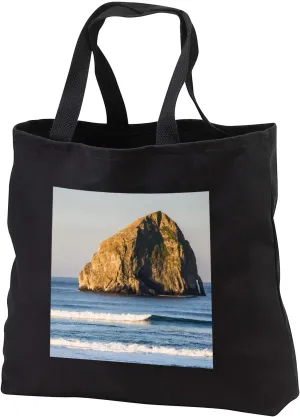 3dRose Oregon. Sunrise on the beach, Haystack Rock in Pacific Ocean. - Tote Bags (tb_346784)